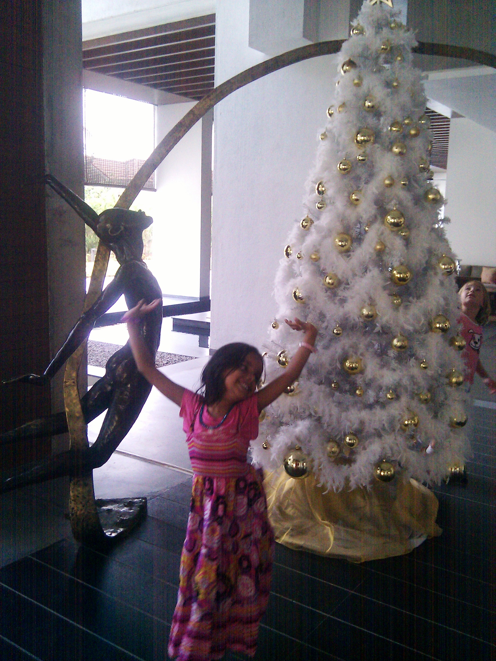 A happy jig in front of the Christmas tree