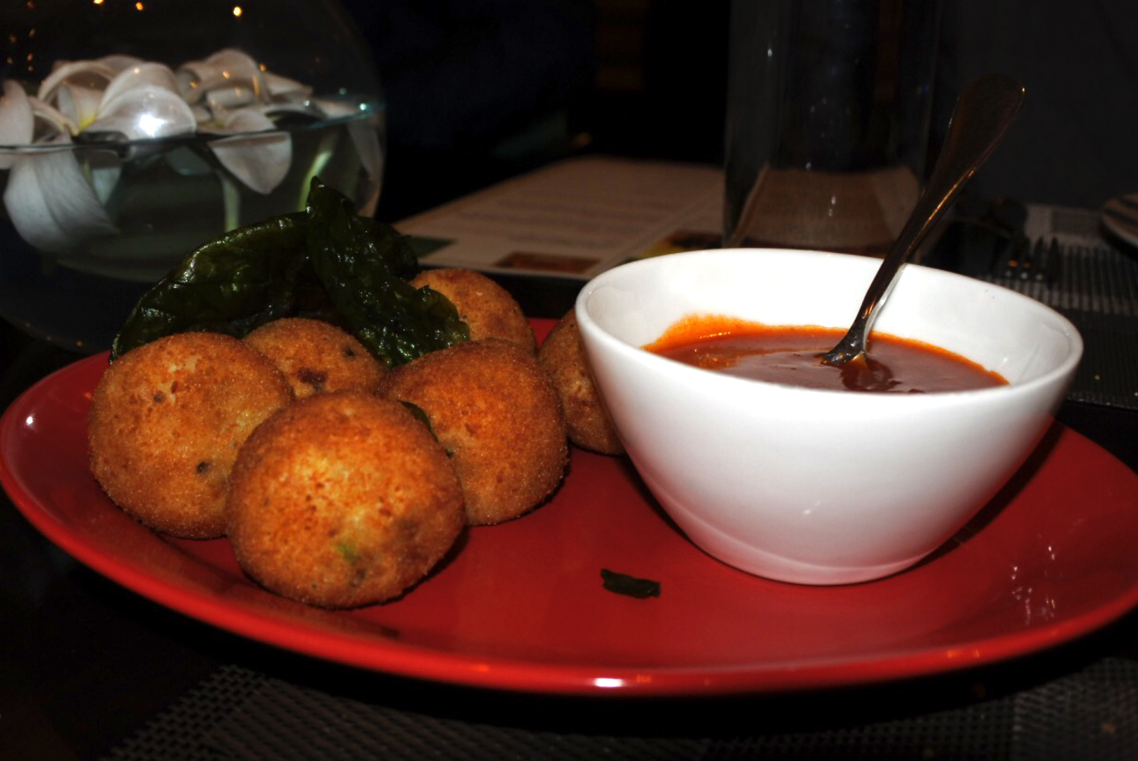The fish cutlets accompanied by a spicy sauce