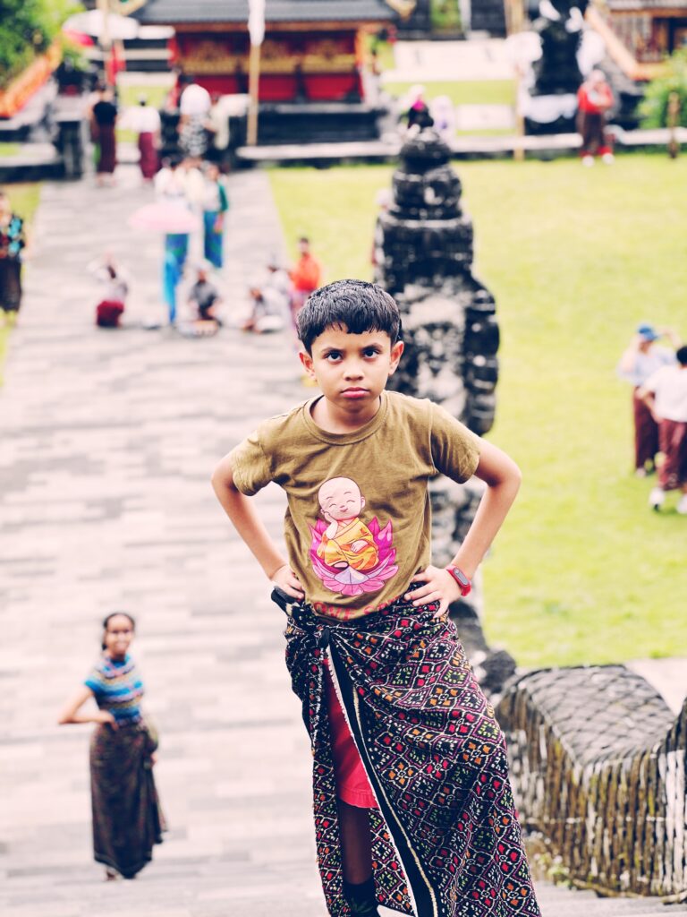 Piglet sulking at Lempuyang because he didn't want to wear a skirt (sarong) and pose for photos.